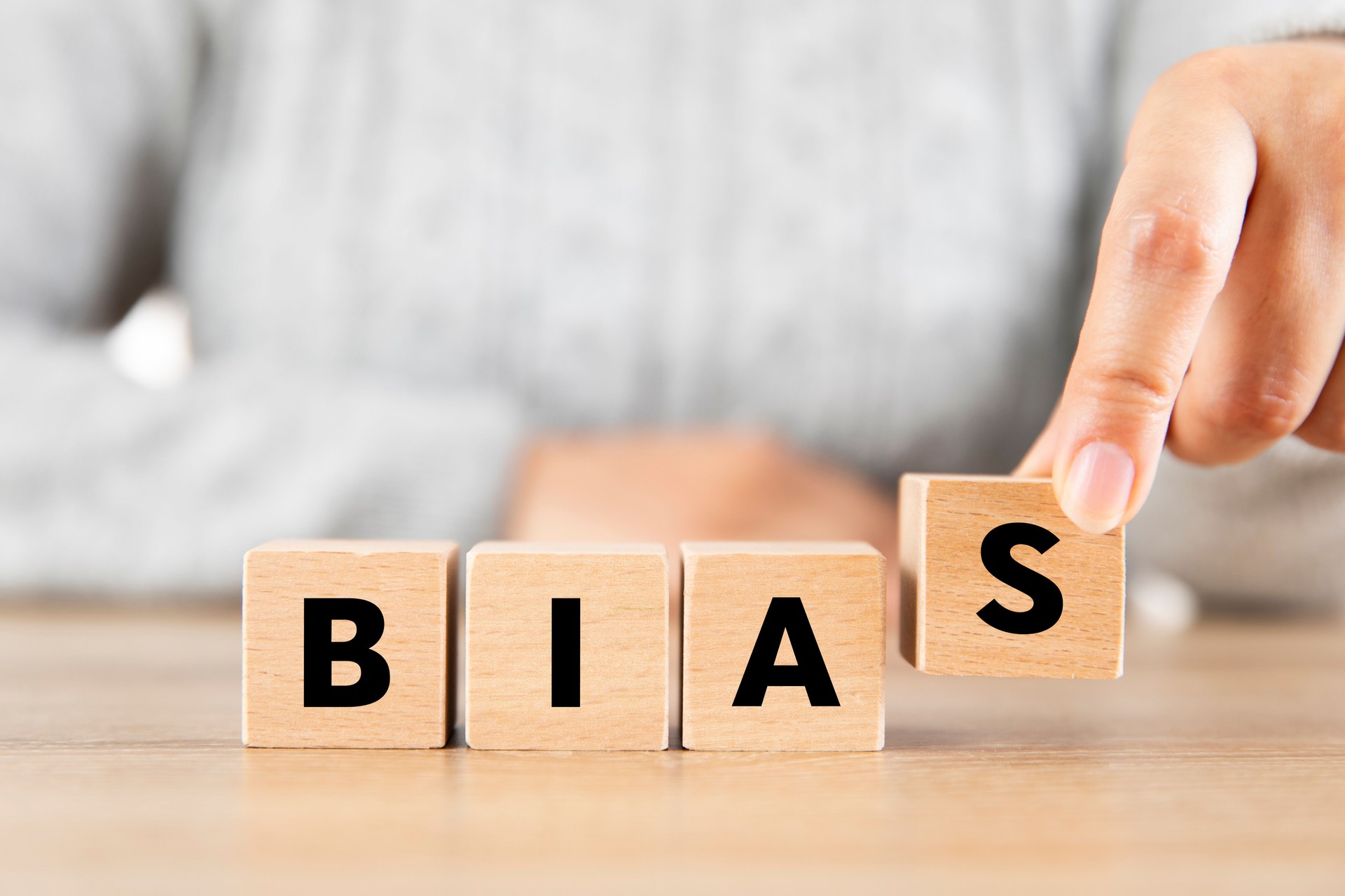 Woman Made Word BIAS with Wooden Blocks